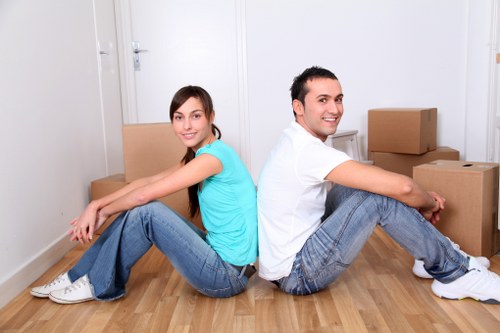 Moving house service in Childshill with packing boxes and a removal van